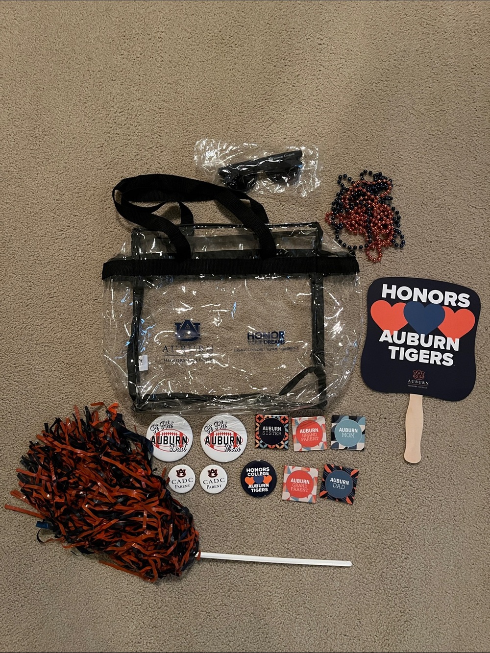 Auburn Clear Game Day Tote Bag with buttons, sunglasses, Pom Pom, and fan